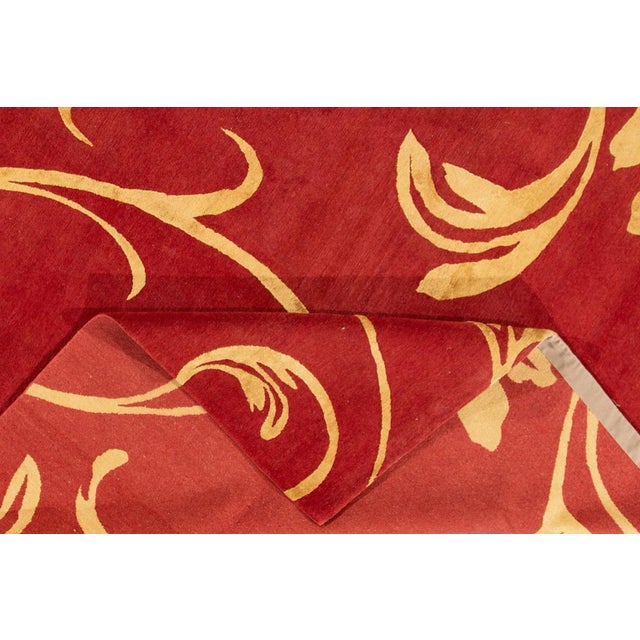 Contemporary Neplaese rug with an all over floral design. This piece has fine details, great colors, and a beautiful...