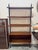 Structure with painted metal uprights equipped with racks that allow for height adjustment. shelves and lower storage unit...
