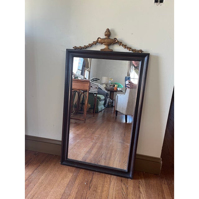 Antique French walnut wood Mirror in the Neoclassical Louis XVI-style with gilt-wood ornamentation at the top. There is...