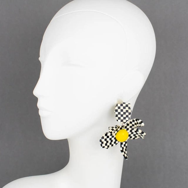 Harriet Bauknight for Kaso designed these stunning Lucite pierced earrings. They feature a dimensional giant flower with a...