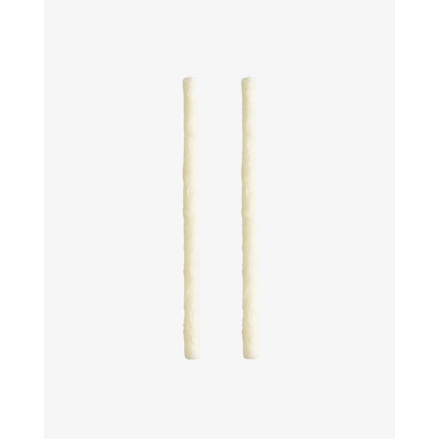 Illuminate your tabletop with a set of two Flora Tapers in Fawn. Each taper features a delicate floral- inspired carving,...