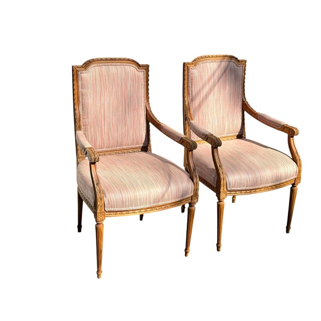 Stunning set of French Louis XVI arm chairs upholstered in a pink and green fabric. Beautiful carved details - acanthus...