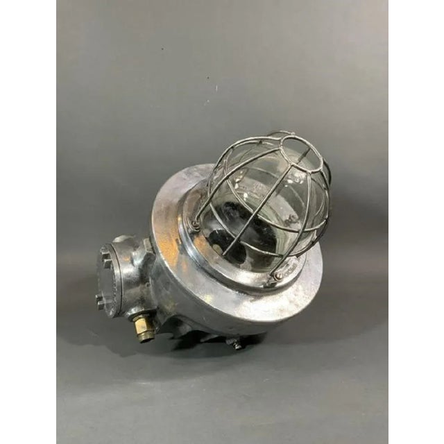 Baliga ships cargo light with glass lens and protective case. Hoisting ring attached. marked isolate supply. Overall...