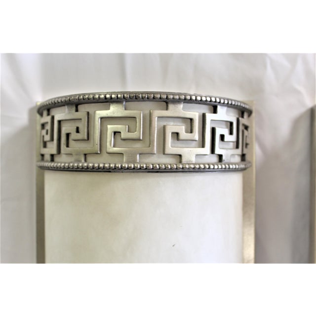 Custom made Cast bronze frames after the most popular Art Deco Designer ( Ruhlmann ). Imported Alabaster shades made...