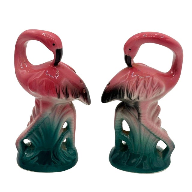 Mid-century pink and green ceramic flamingo tabletop salt & pepper shaker set by Sarsaparilla from the 1980s. The set...