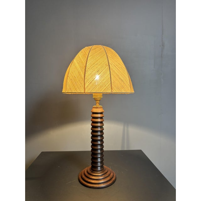 Lovely French wood turned table lamp, 1950s with linnen mushroom shade 1960s. This lamp has been refitted with a lovely...