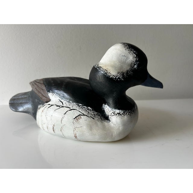 Skillfully crafted hand-carved and painted wooden bufflehead duck decoy. Decoy features the bird's characteristic stark...