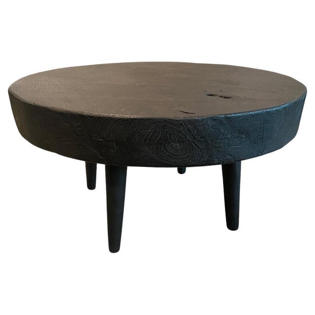 Impressive 3.5" thick reclaimed teak wood single slab coffee table. Floating on mid century style cone legs and finished...