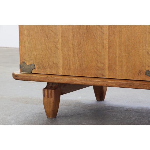 Danish Brutalist oak chest attributed to Henning Kjærnulf, crafted in Denmark during the 1960s. The piece has a strong...