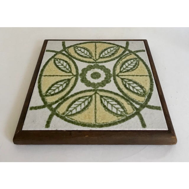 Gorgeous green, white and yellow tile trivet that was made in Italy. The tile is framed in wood. Great piece for warming...