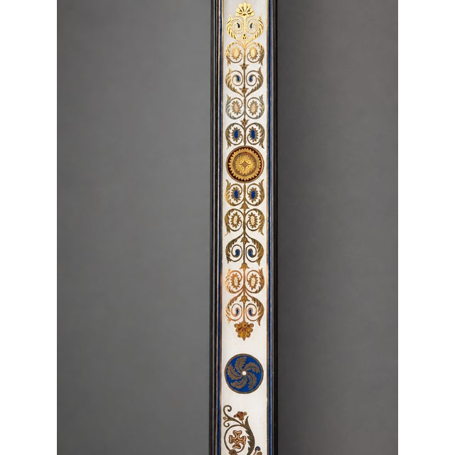 A finely decorated French Charles X style verre églomisé mirror, circa 1860, with a rectangular frame bordered by reverse-...