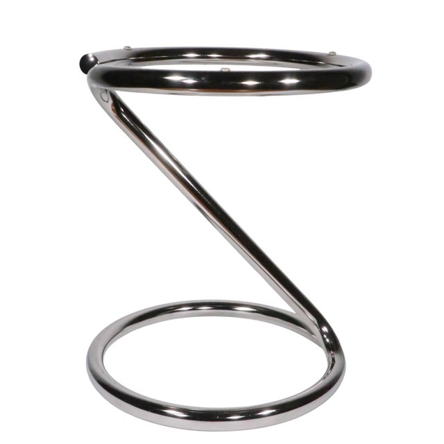 Chic tubular chrome base, glass top side table, in excellent, original, clean and ready to use condition. Mid Century,...