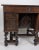 Antique walnut kneehole desk, circa late 18th C. Hinged top opens to several small small drawers. Each side of the...