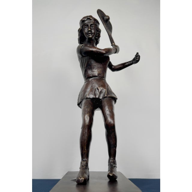This exceptional mid-century modern solid cast brass female tennis player sculpture stands a commanding 14 inches tall and...
