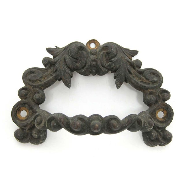 Traditional bronze handles for a chest or trunk. They are also great as drawer pulls. Good condition with appropriate wear...