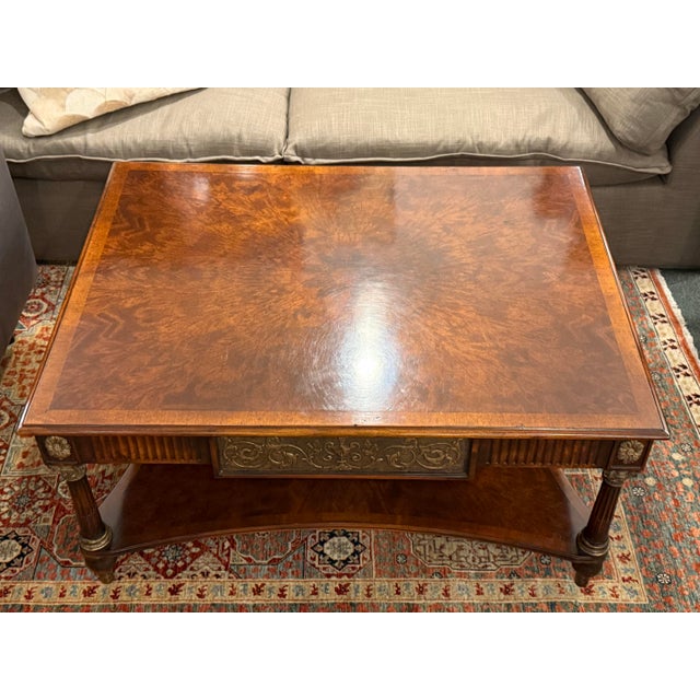 Design Plus Gallery presents a Classical Gathering Cocktail Table from Theodore Alexander. This Regency style table...