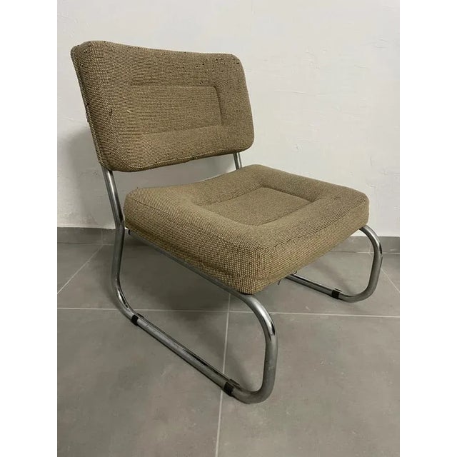 Pair of Italian design armchairs from the 70s, chromed steel structure, sitting in vintage fabrics from the Versoni...