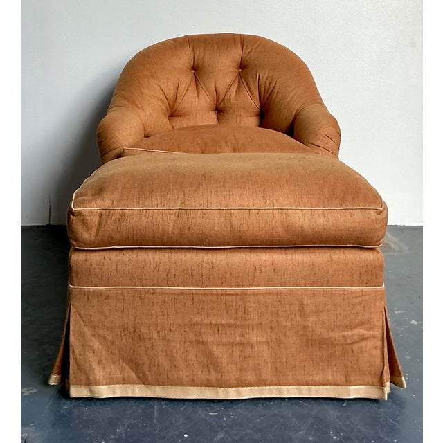 Description: Embrace the opulent comfort of the Hollywood Regency era with this vintage tufted barrel-back lounge chair...