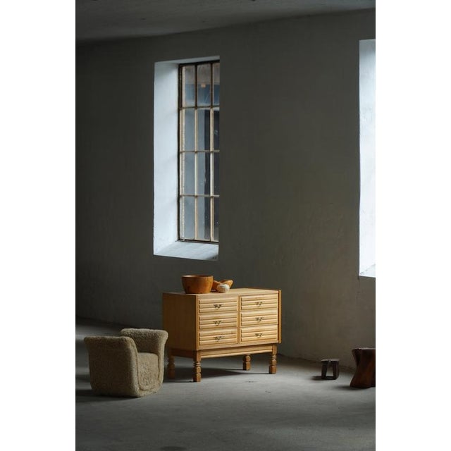 A charming modern chest of drawers crafted in oak, circa 1950s by a Danish Cabinetmaker. The cabinet features six drawers...