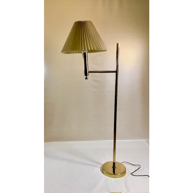 Bergboms' G-018 floor lamp adds a touch of sophistication to any space. Its frame, crafted from brass, bestows a classic...