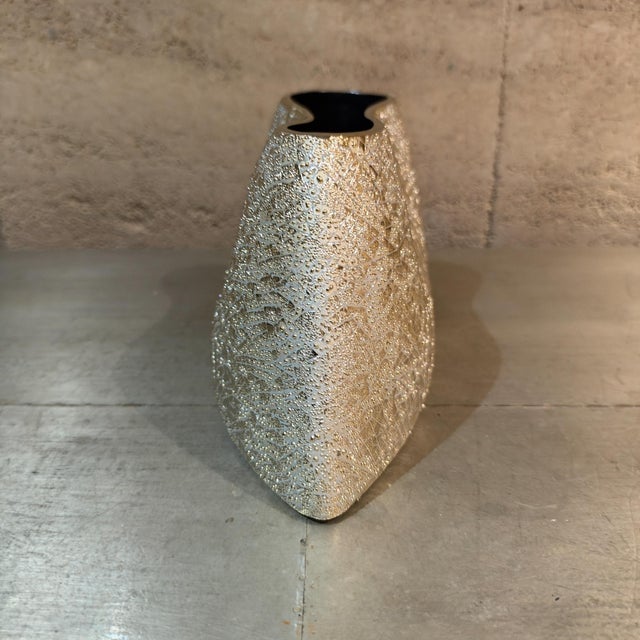 For your consideration, a contemporary decorative ceramic decorative vase. It is characterized by an irregular, organic...