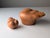 This unique terracotta sculpture, created by Ricardo Mesa in the 1980s, comprises two separate ceramic pieces: a...