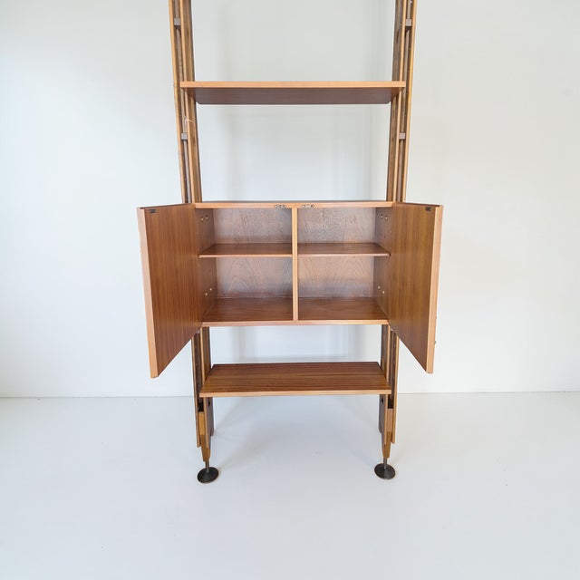 LB7 single-module bookcase by Franco Albini for Poggi. The bookcase is made of walnut and features four shelves and a...