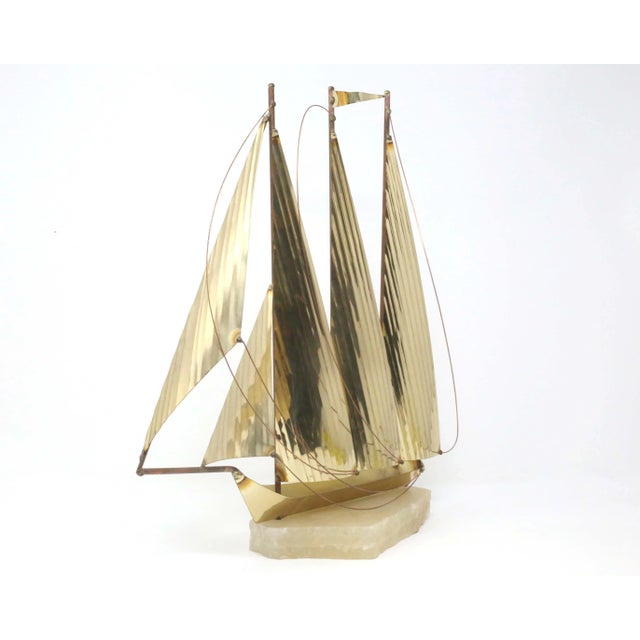 TALL and Spectacular!! A vintage, handmade figure of a sailboat, formed with shaped and welded brass/gold-colored metal,...