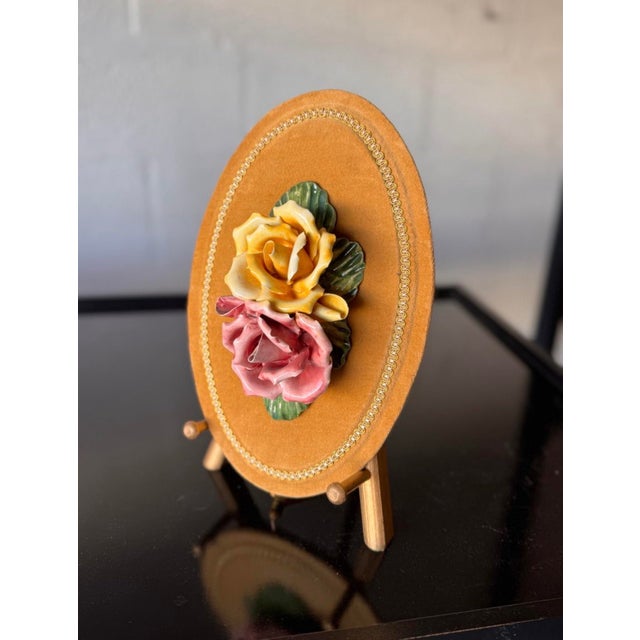 Elegant and richly detailed, this vintage Italian Capodimonte-style wall plaque features a beautifully sculpted bouquet of...