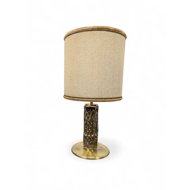 Pair of brass table lamps with a sculptural "bark" finish and a disc base. Excellent condition, like new. No reported...