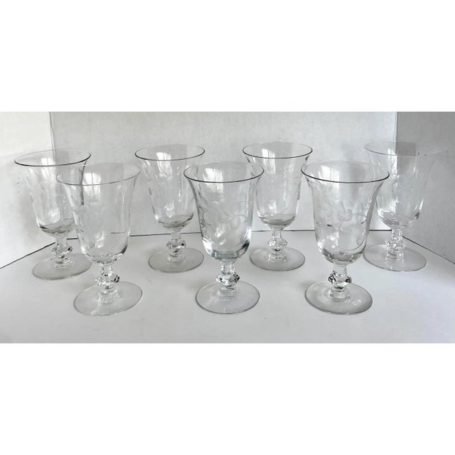 Here is a gorgeous set of 7 glasses made by Heisey in the 1940's. The glasses feature a shorter stem with etched roses and...