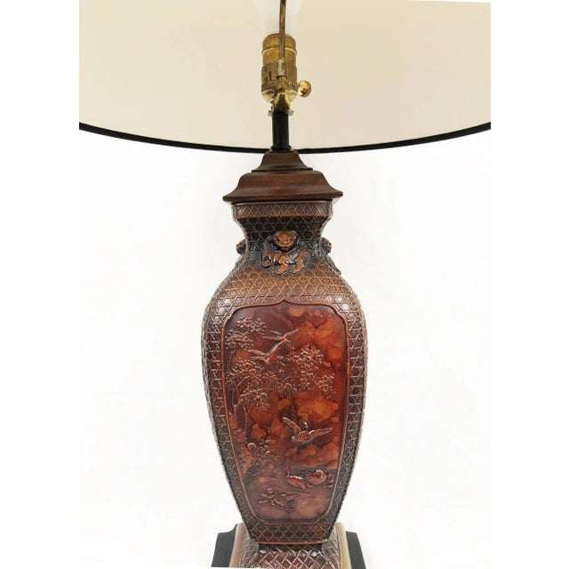 Maitland Smith Asian Porcelain table lamp with black shade.