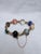 A beautifully preserved mid‑century carved gemstone scarab bracelet for collectors of Egyptian Revival and natural...
