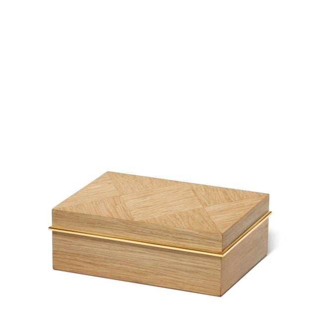 Inspired by Art Deco-style wood marquetry, the Marcello box is crafted in light European oak with an oiled finish,...