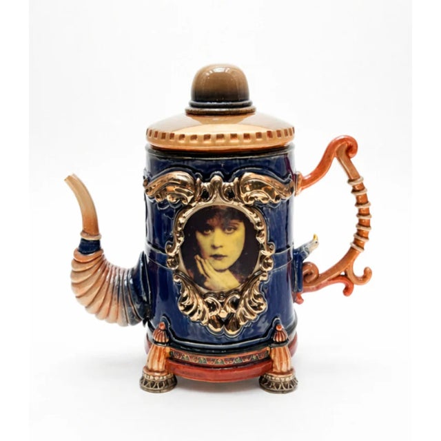 Large Blue and Gold Teapot with Orange Handle and Spout is a vibrant celebration of color, craftsmanship, and imaginative...