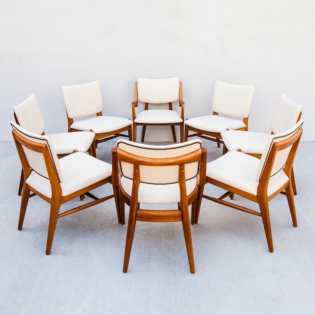 Immaculately restored set of 8 mahogany dining chairs by Brown Saltman, made in Southern California c. 1950s. The chairs...