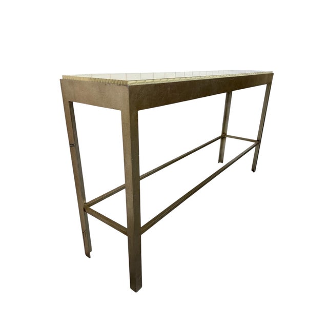 Striking vintage Baker Furniture console table, circa 1980s, featuring a sophisticated tessellated top paired with a...