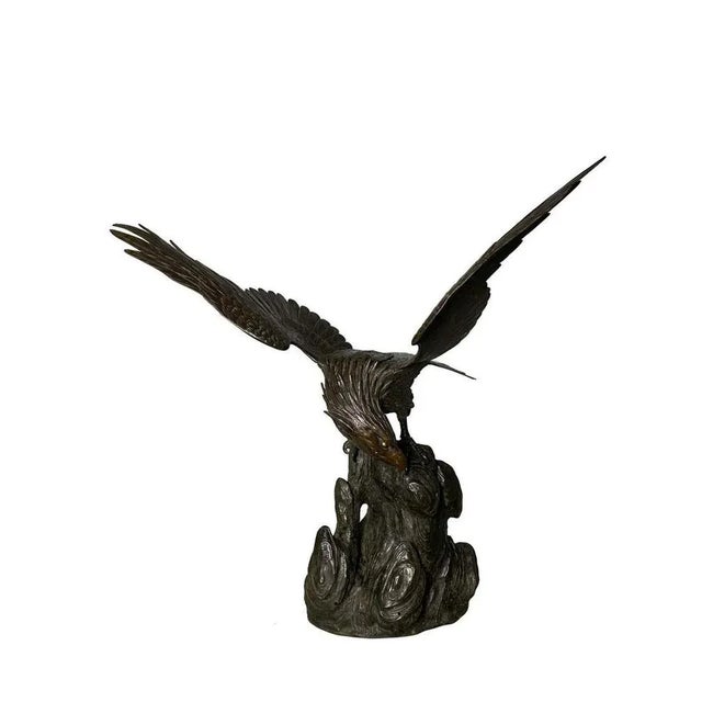 With extended wings, this cast bronze eagle statue has a regal and powerful stance, symbolic of freedom and power. The...