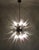 Italian Sputnik chandelier in a black and brass metal, 51 unobtainable transparent glass tips. Murano blown glass in a...