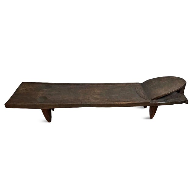 Authentic old wood Senufo low profile bed table from Western Africa area. Simple modern form carved from a single piece of...