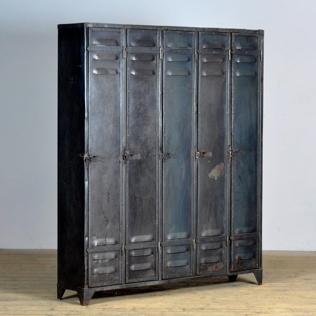This locker was made in Germany around 1950 and has five compartments to store all your belongings. In the upper part a...
