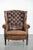We are offering this unique, large English-style sheepskin Chesterfield wingback chair, featuring beautiful details and...