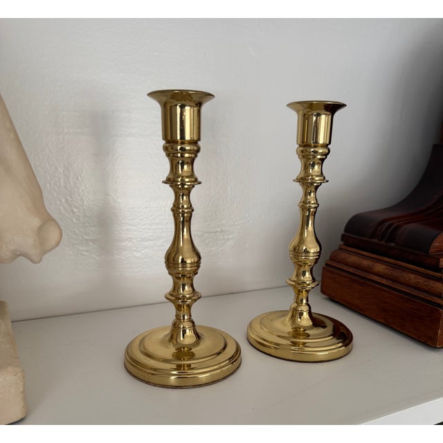 Elevate your tabletop with this elegant pair of vintage solid brass candlesticks by Baldwin. Known for exceptional...