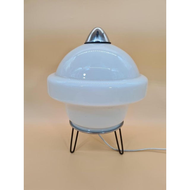 A decorative table lamp in the space age style characteristic of European design of the 1960s and 1970s. The form is based...