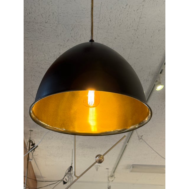 Design Plus Gallery presents the Egg Drop Pendant in Bronze/Brass from Arteriors. This playfully named hi and low...