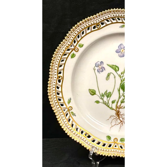 Royal Copenhagen Flora Danica Porcelain Plate, Geum rivale L, with Pierced Gilt Border. Each plate in this collection...
