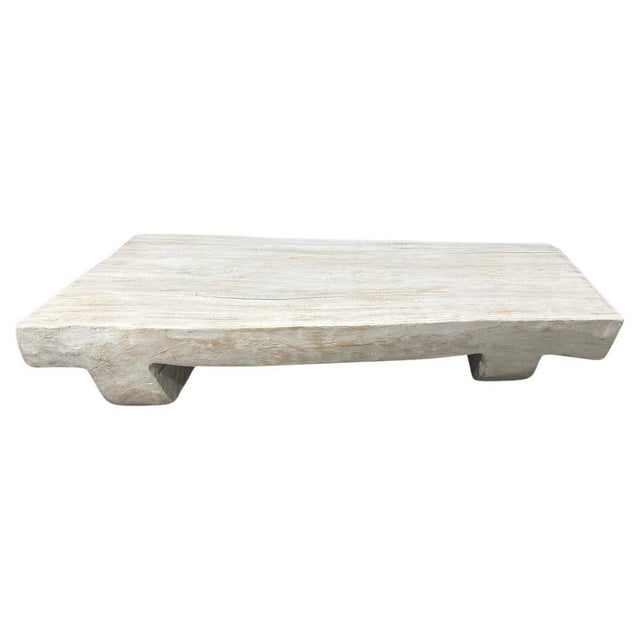 Coffee table hand carved from a single suar wood log. The legs and top are carved from one piece of wood with no joins....