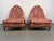 Striking pair of walnut lounge chairs upholstered in bold red fabric and styled after the glamorous gondola design of...