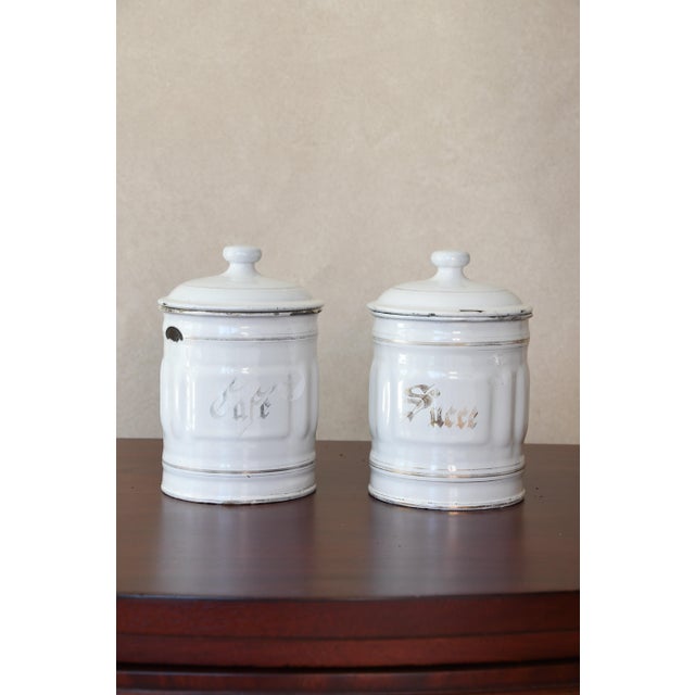 A quaint ceramic jar formerly used to store sugar in a kitchen or pantry. A charming addition to a French cottage style...