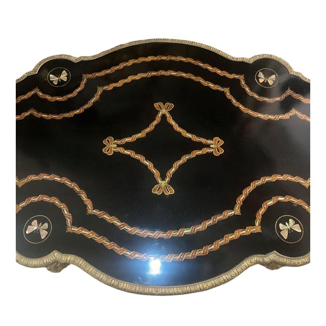 A refined and elegant 19th-century French biscuit writing desk from the Napoleon III period, masterfully crafted in...